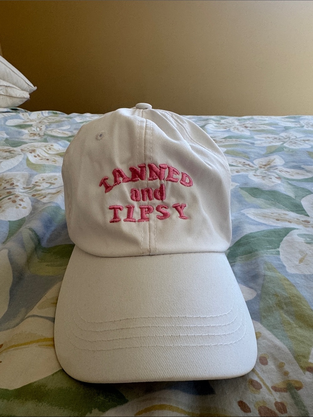 White Baseball Cap with Pink Embroidered 'Tanned and Tipsy'